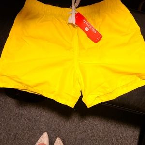 Yellow short bathing suit shorts